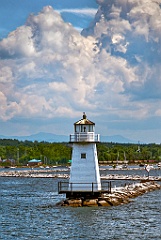 Burlington Breakwater North Light Under Puffy Clouds